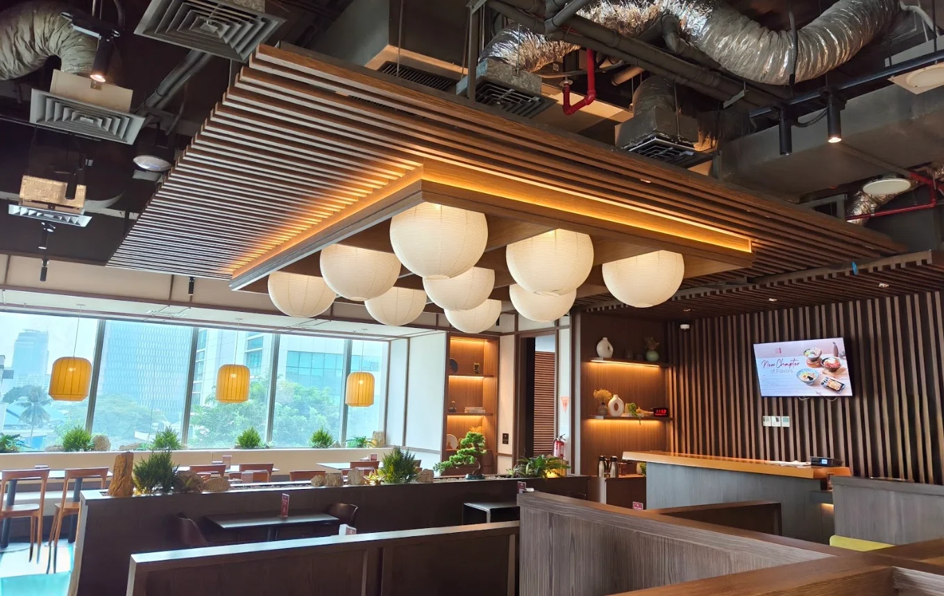 JINSEI dining room with wood slat ceiling and glowing paper lanterns